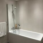 Wall mounted bath screen with rust proof stainless steel trim UAE